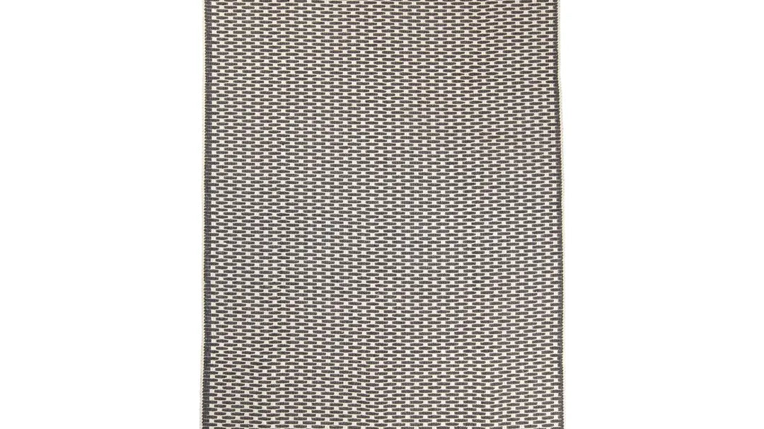 Anthracite geometric check low-pile machine washable area rug suited to a heated floor