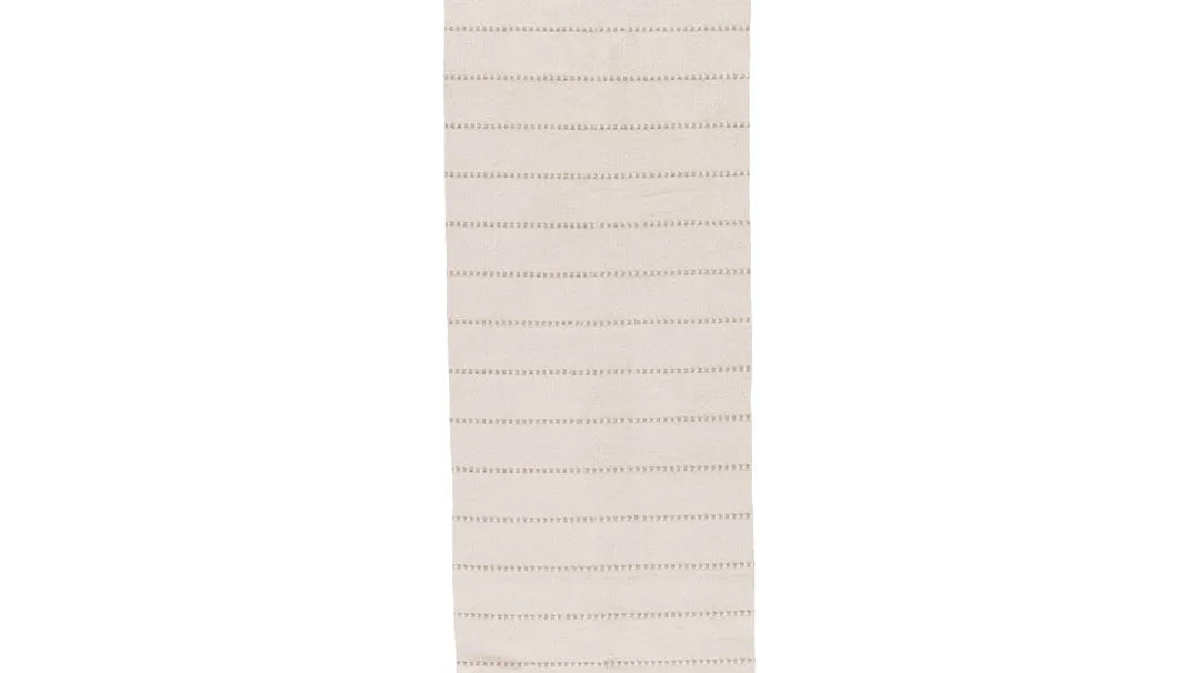 Beige classic stripe machine washable runner rug laid on a hardwood floor
