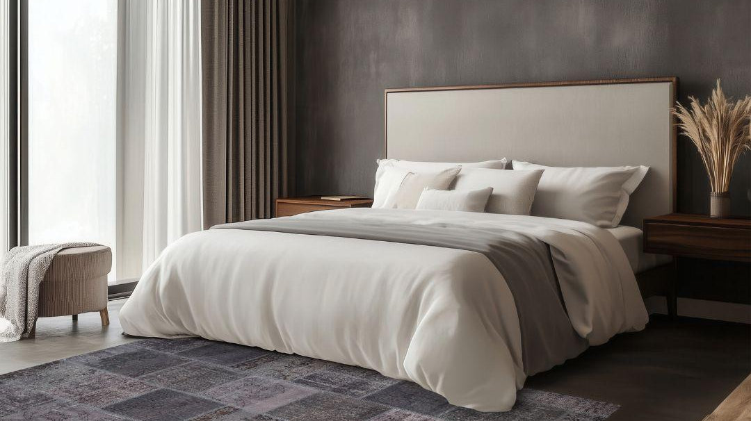 Modern bedroom with dark patchwork Turkish washable area rug on tile floor