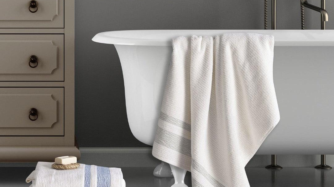 Elegant bathroom with Turkish cotton jacquard bath towels in light green and neutral tones