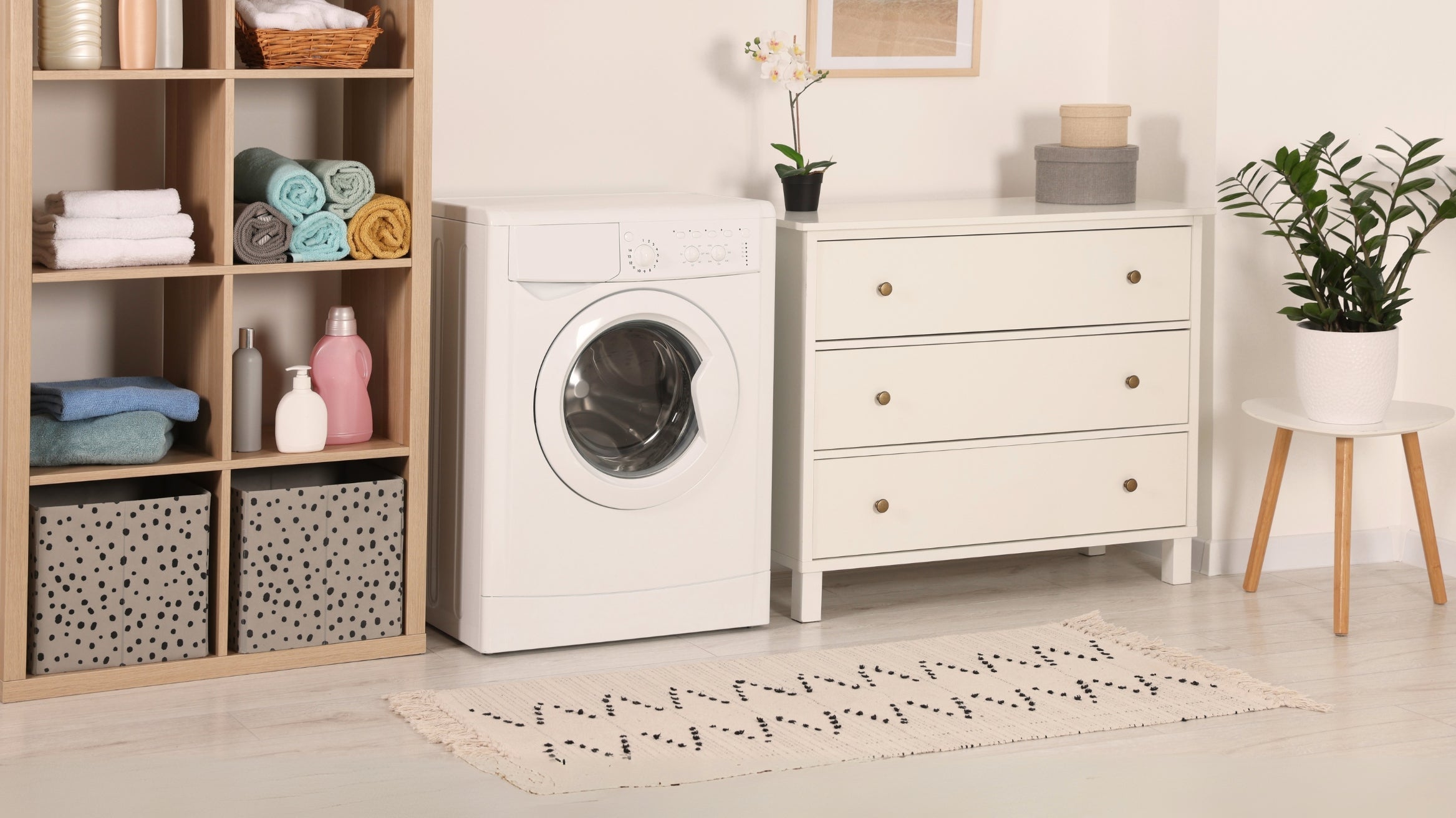 Machine washable Turkish area rug in modern laundry room with washing machine and storage shelves