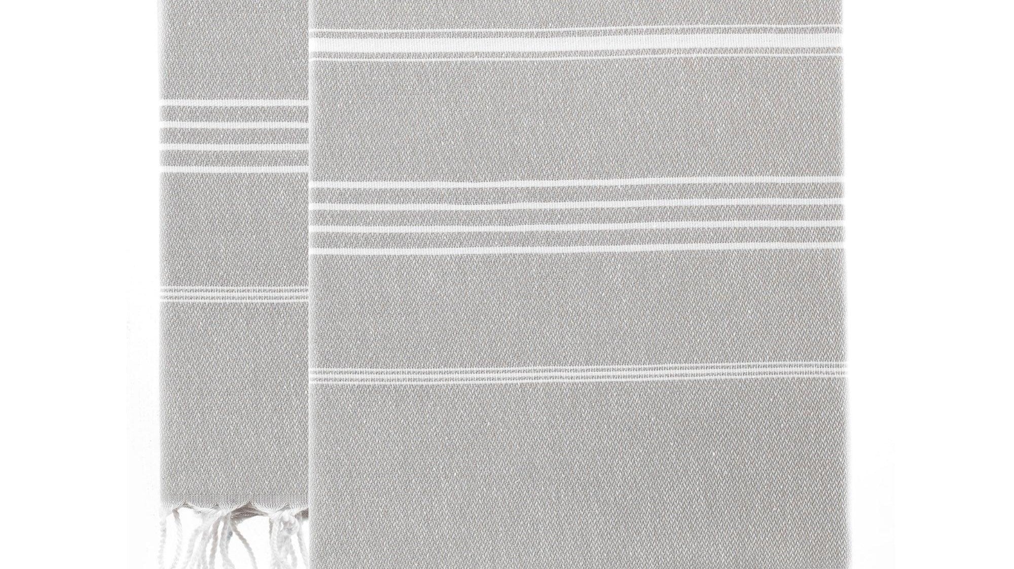 Light grey Turkish cotton towel that works as both a beach towel and a bath towel