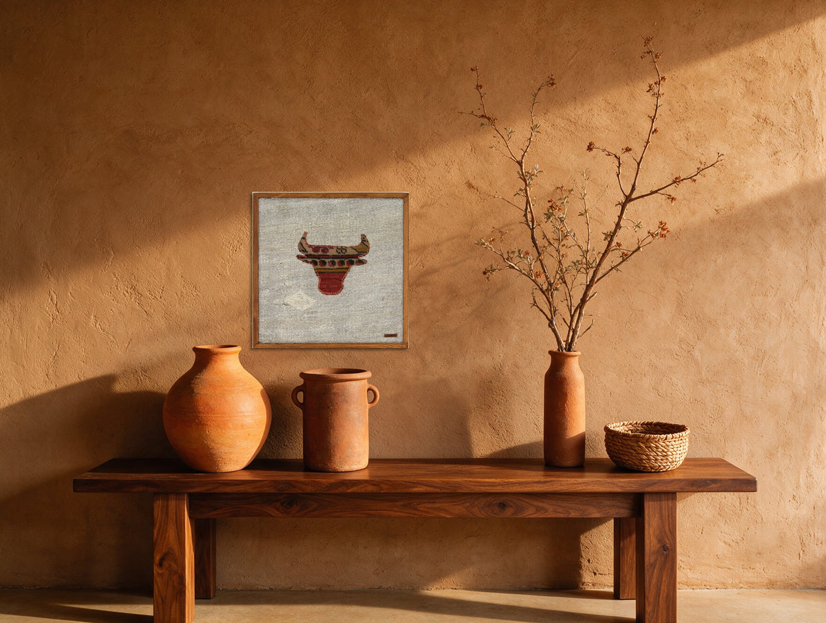 Tan & Red Kilim Bull on Pale Grey woven wall art shown hanging in a styled room, for scale - WA-BUL-TAN-5050-043