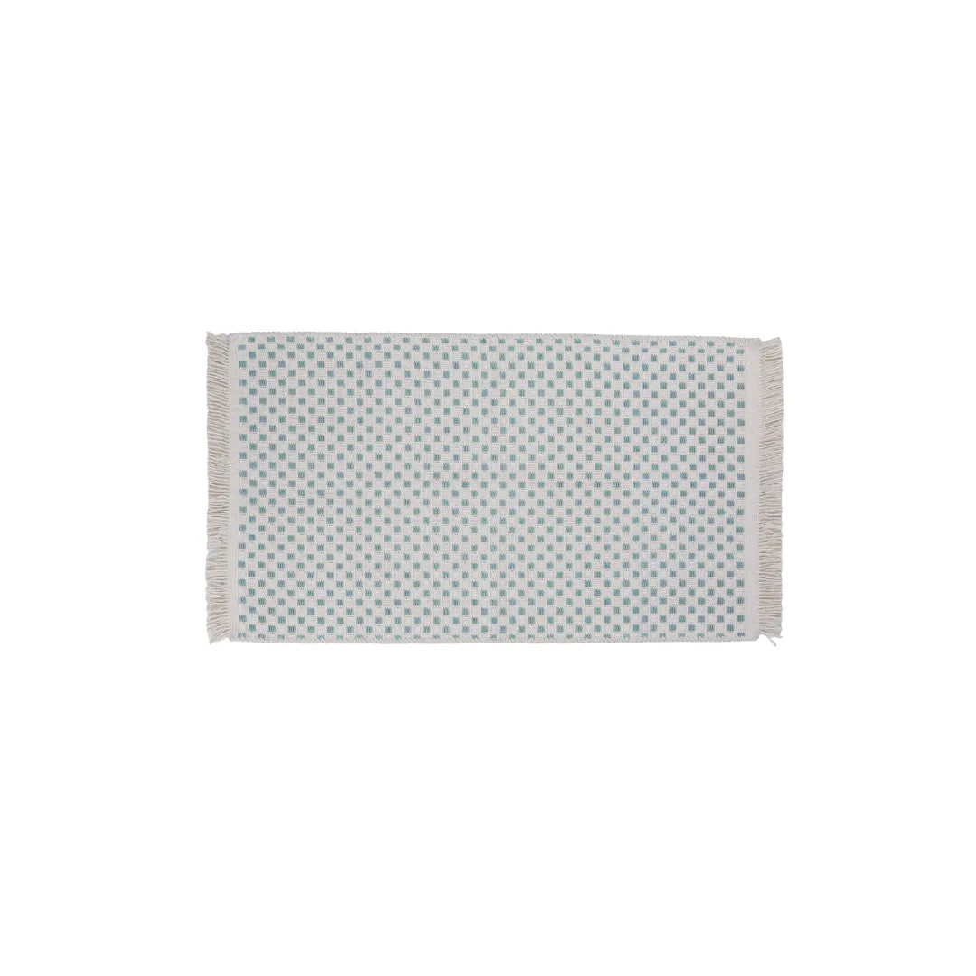 Green modern geometric machine washable area rug holding its color in a sunlit room