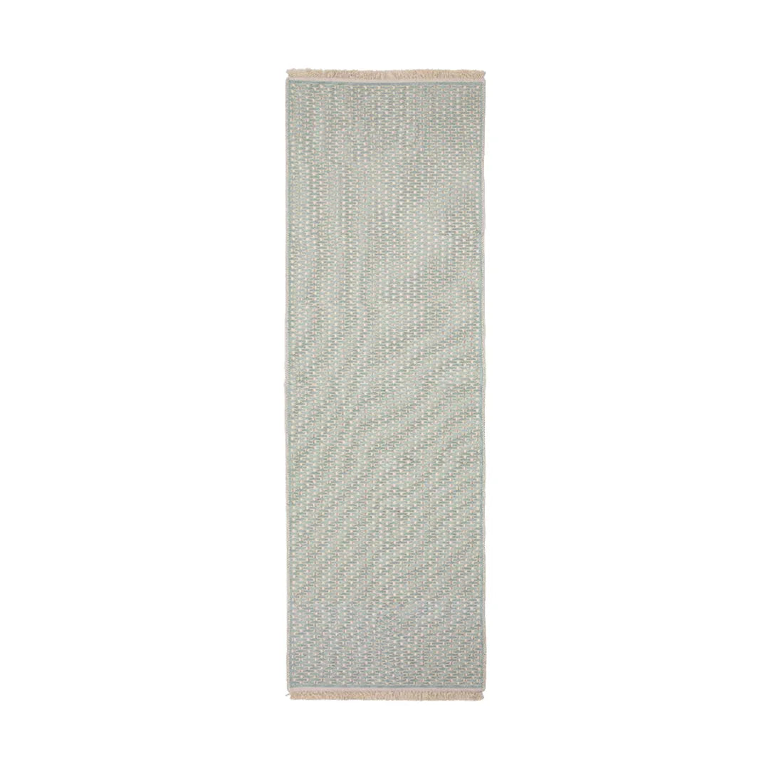 Green geometric check machine washable runner area rug lying flat with non-slip backing