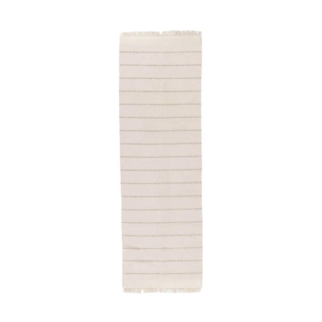 Beige classic stripe machine washable runner rug laid on a hardwood floor