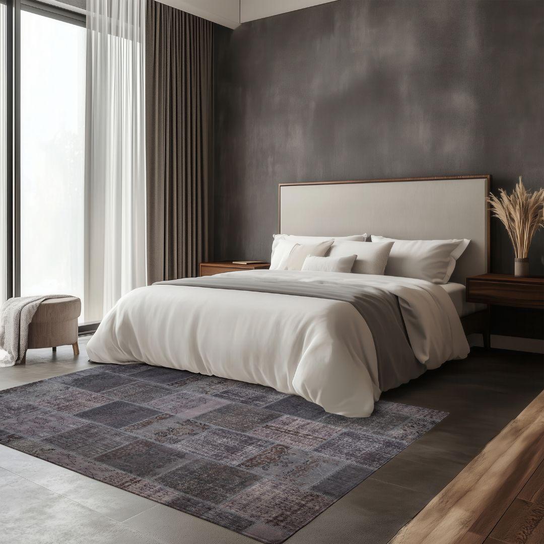 Modern bedroom with dark patchwork Turkish washable area rug on tile floor