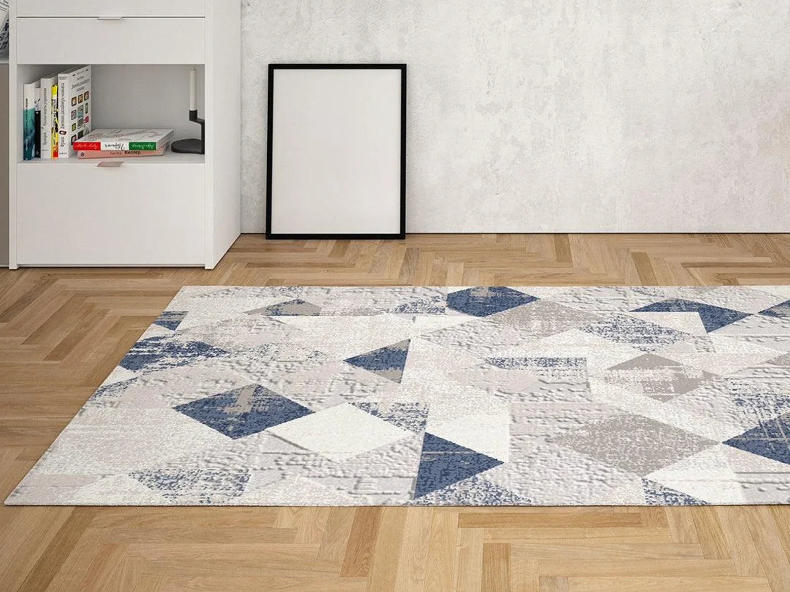 Modern living room with a blue and gray geometric Turkish washable area rug on wood floor
