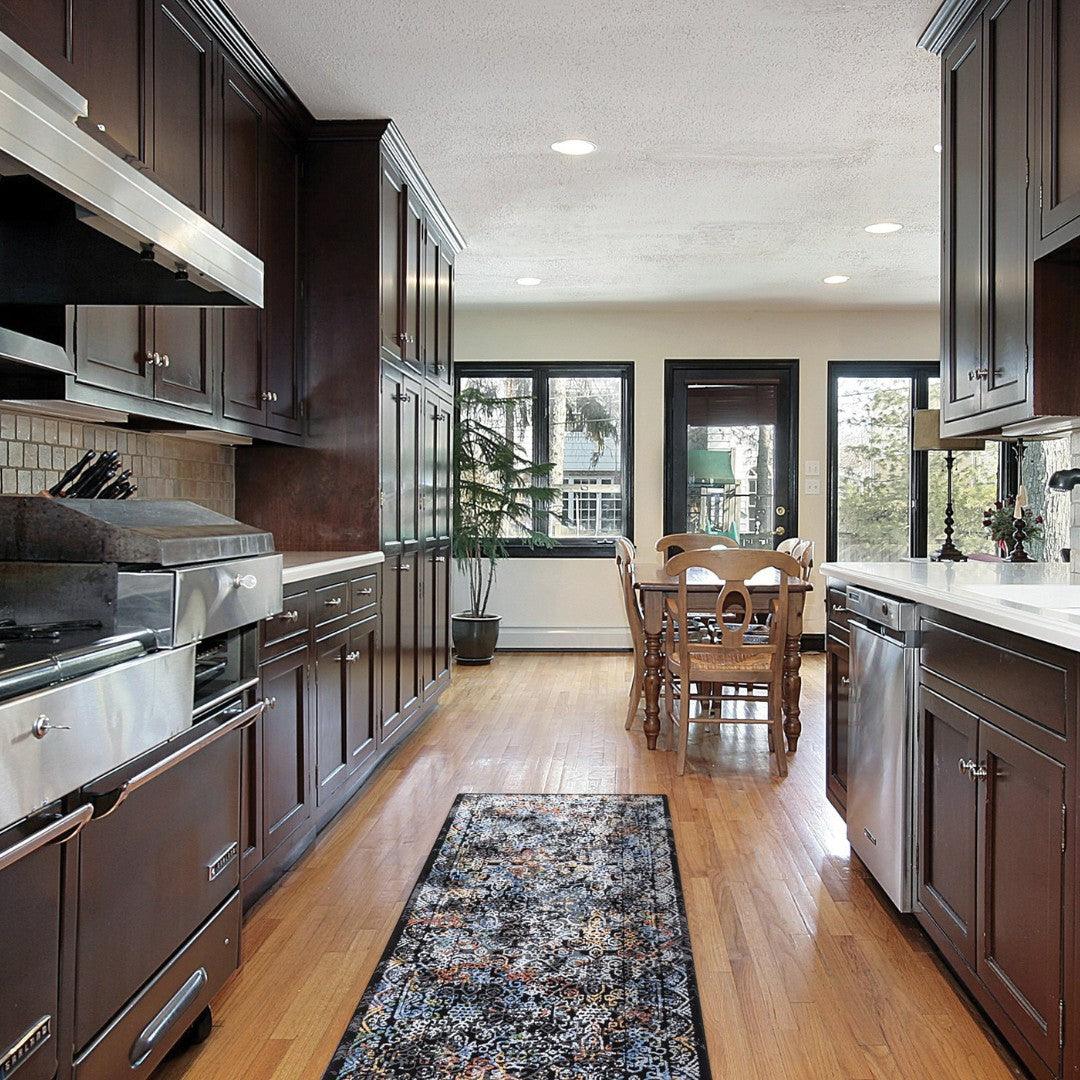 Turkish washable area rug runner in a modern kitchen with wood flooring and dark cabinets