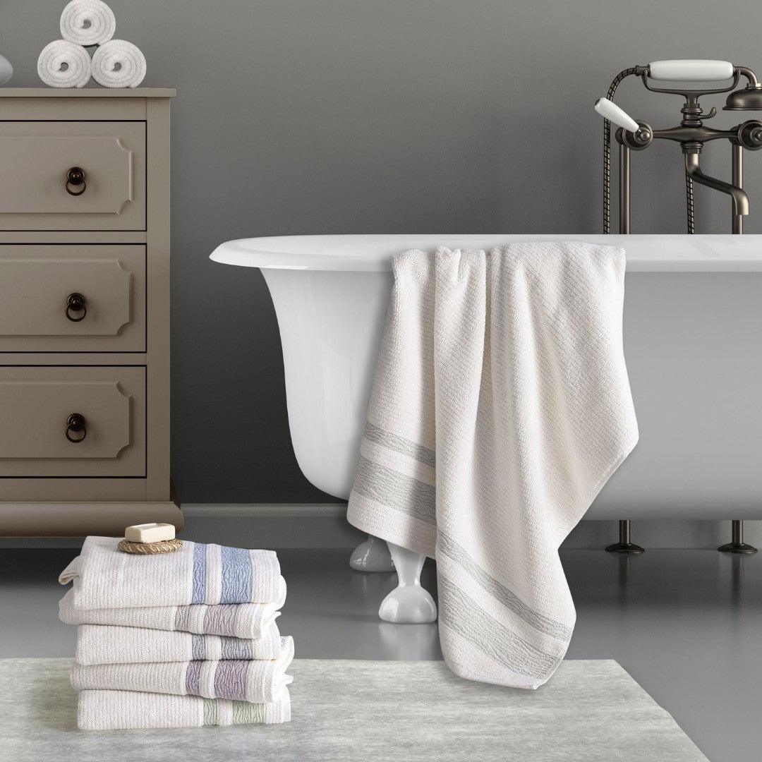 Elegant bathroom with Turkish cotton jacquard bath towels in light green and neutral tones