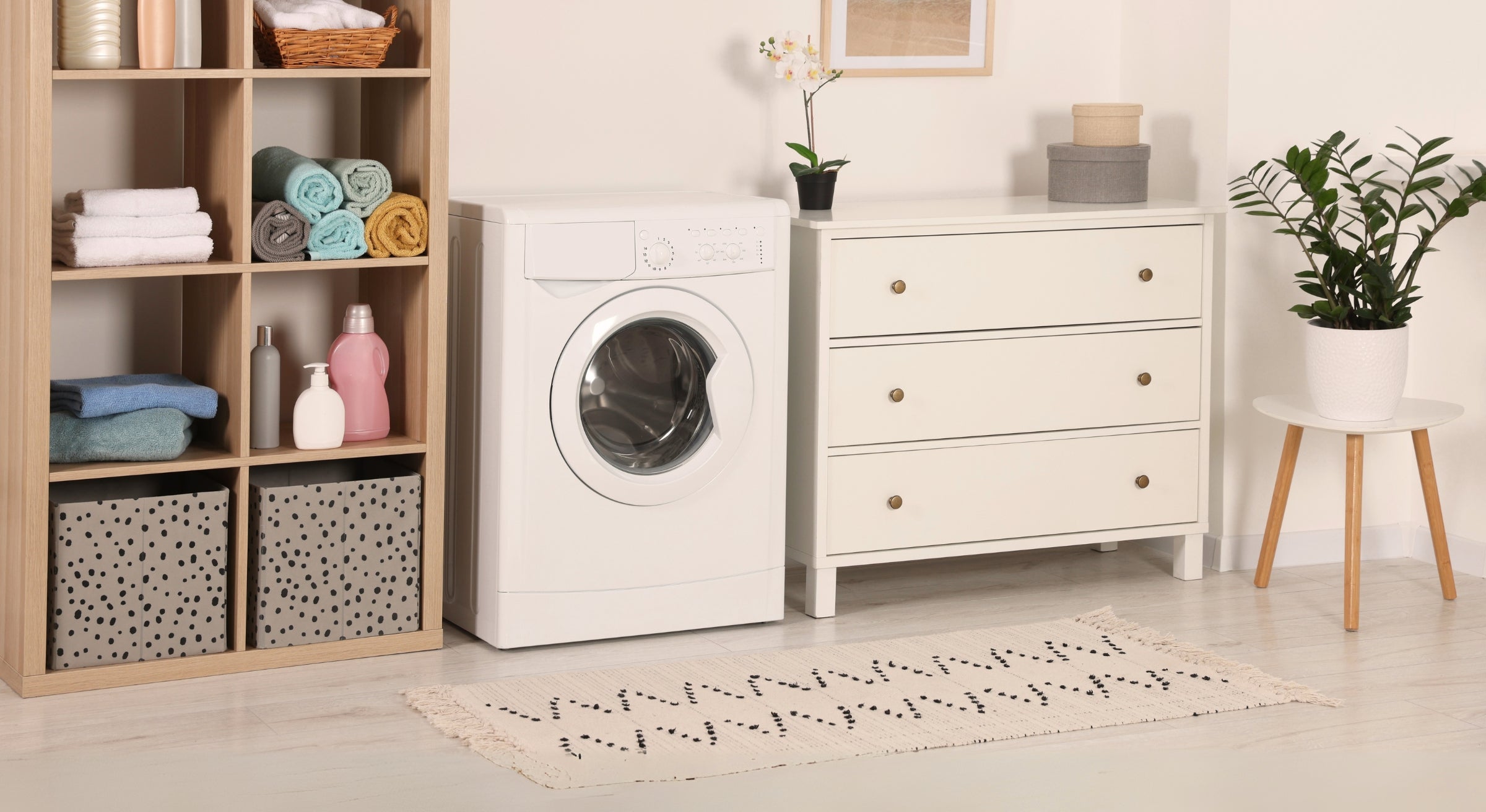 Machine washable Turkish area rug in modern laundry room with washing machine and storage shelves