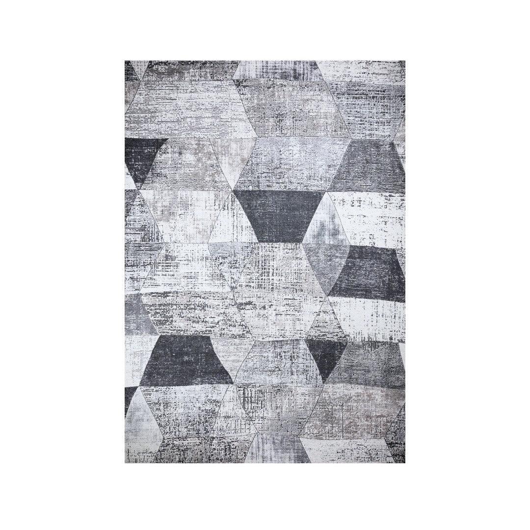 Modern geometric area rug in an 8x10 size anchoring a living room