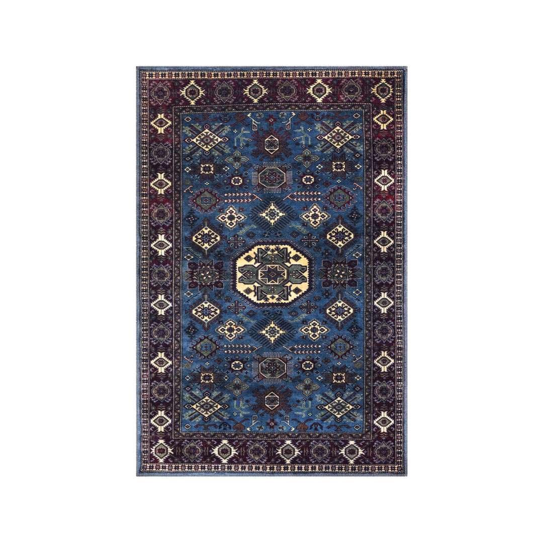 A large navy blue area rug being cleaned at home