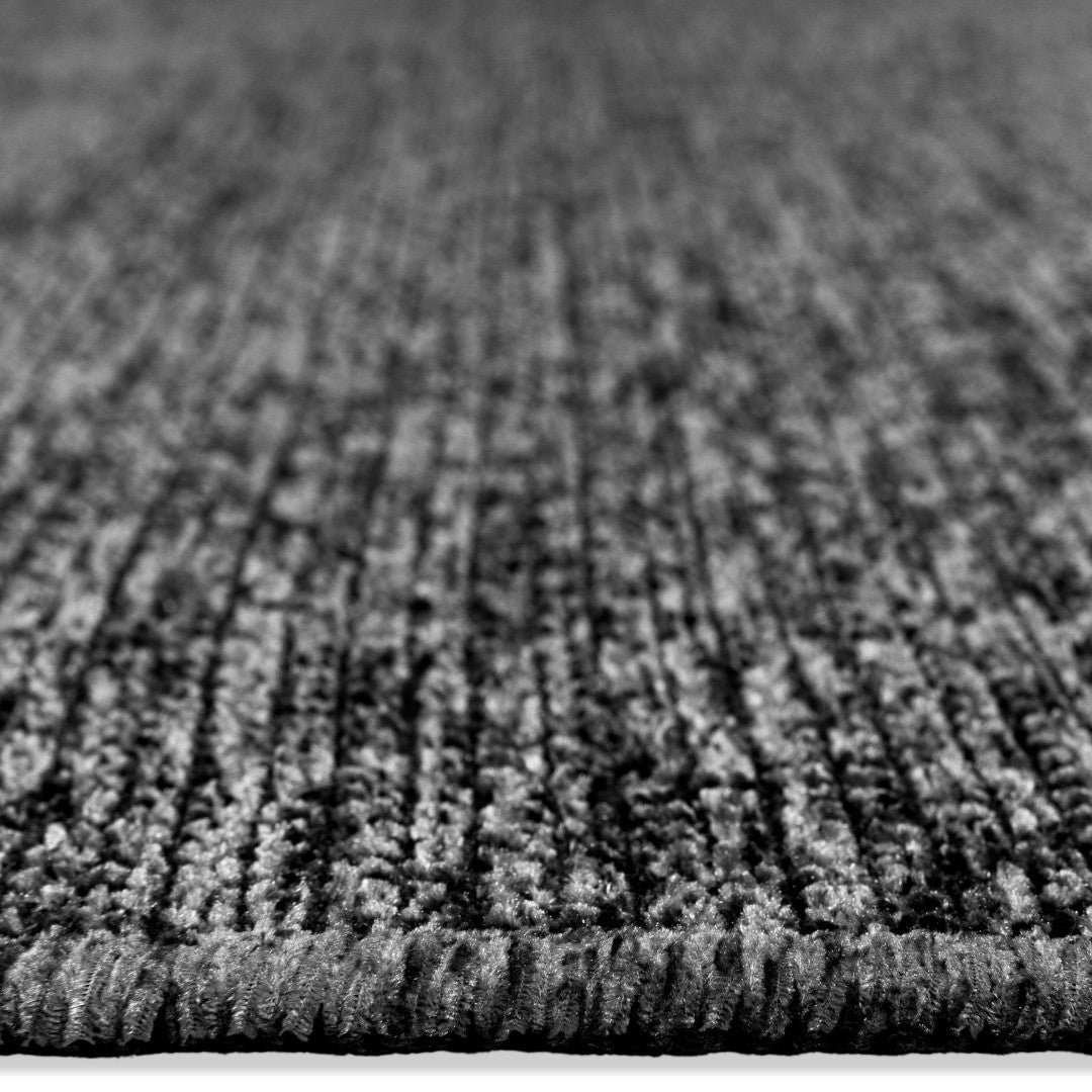 Machine washable solid dark gray area rug, 100% recycled material, kid and pet-friendly, eco-friendly