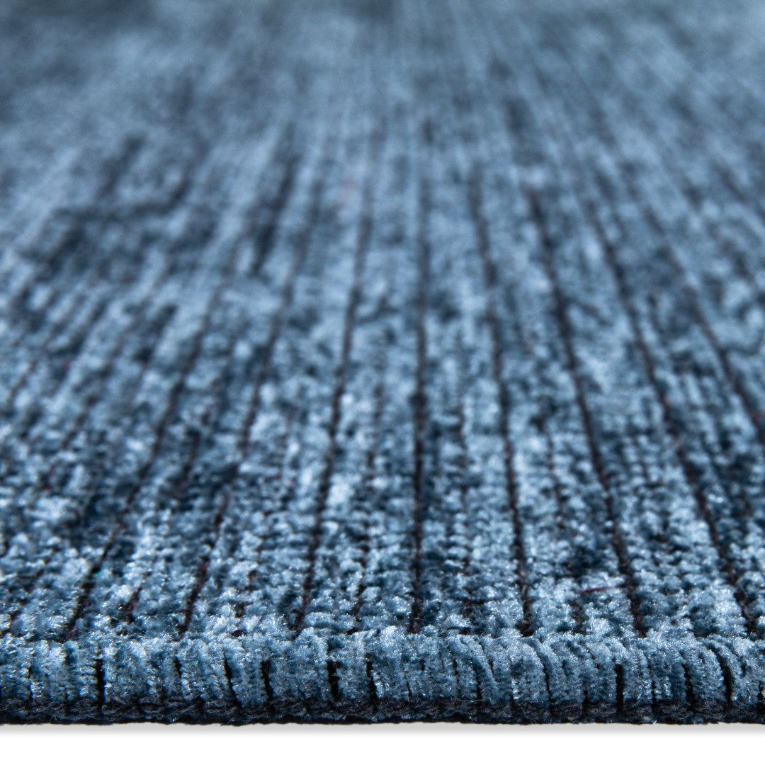 Machine washable solid blue area rug in slate blue color, made from recycled materials, kid and pet-friendly, available in sizes 2x6, 3x5, 5x7, 8x10