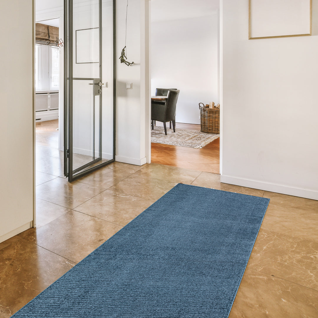 Machine washable solid blue area rug in slate blue color, made from recycled materials, kid and pet-friendly, available in sizes 2x6, 3x5, 5x7, 8x10