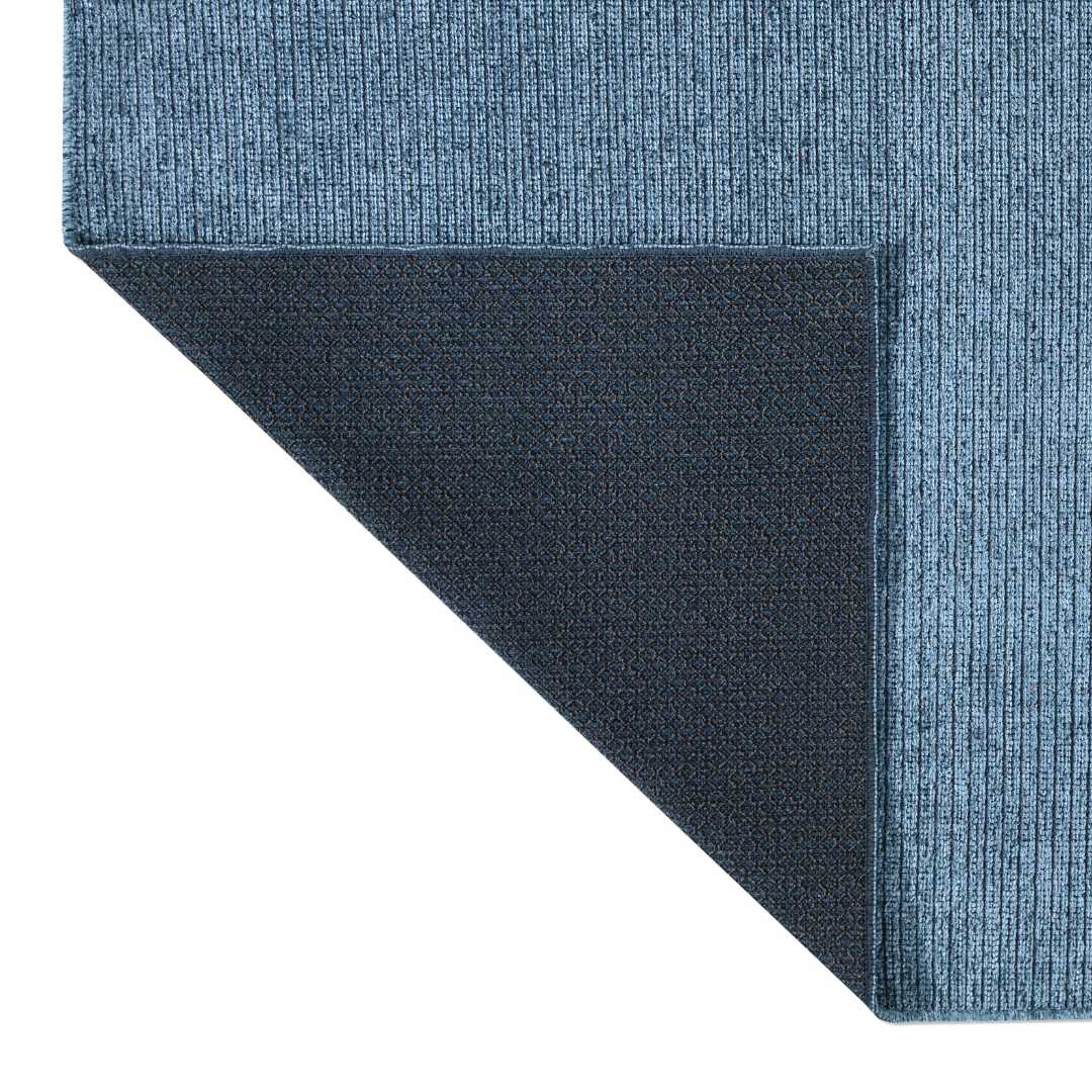 Machine washable solid blue area rug in slate blue color, made from recycled materials, kid and pet-friendly, available in sizes 2x6, 3x5, 5x7, 8x10