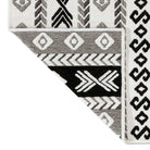 Machine washable reversible black and white geometric area rug, available in 3x5, 5x7, 8x10, made from recycled materials, kid and pet friendly