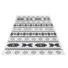 Machine washable reversible black and white geometric area rug, available in 3x5, 5x7, 8x10, made from recycled materials, kid and pet friendly