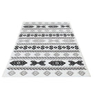 Machine washable reversible black and white geometric area rug, available in 3x5, 5x7, 8x10, made from recycled materials, kid and pet friendly