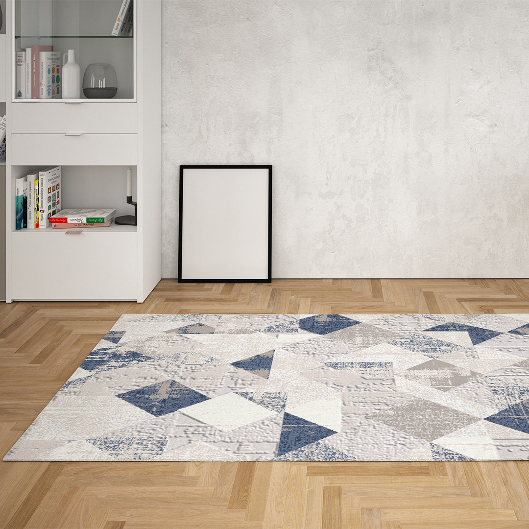 Geometric pattern area rug in distressed blue and gray, modern abstract 5x7 design, soft high-pile, durable for high traffic, no shedding