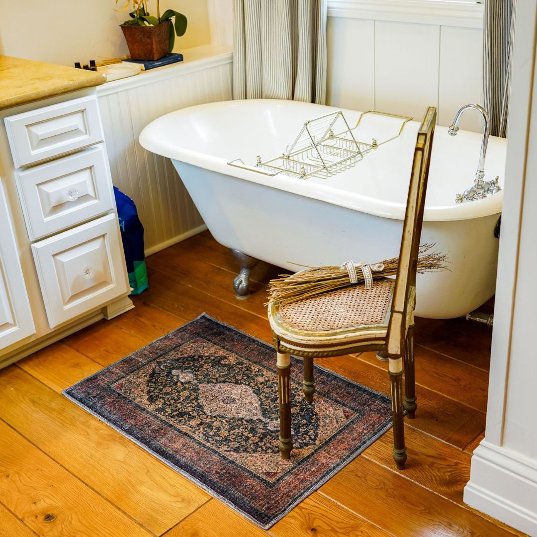 Machine washable Oriental rug with vintage distressed medallion design, navy gold and antique blue-gold color, available in 2x3 and 3x5 sizes, pet and kid friendly, made from recycled materials, features a decorative border.