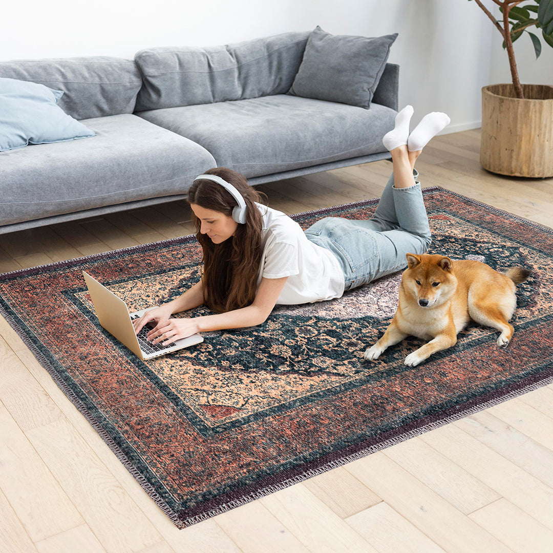 Machine washable Oriental rug with vintage distressed medallion design, navy gold and antique blue-gold color, available in 2x3 and 3x5 sizes, pet and kid friendly, made from recycled materials, features a decorative border.