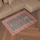 Machine washable area rug with blue and red decorative border, traditional floral pattern, kid and pet friendly, vintage distressed look, made from recycled materials