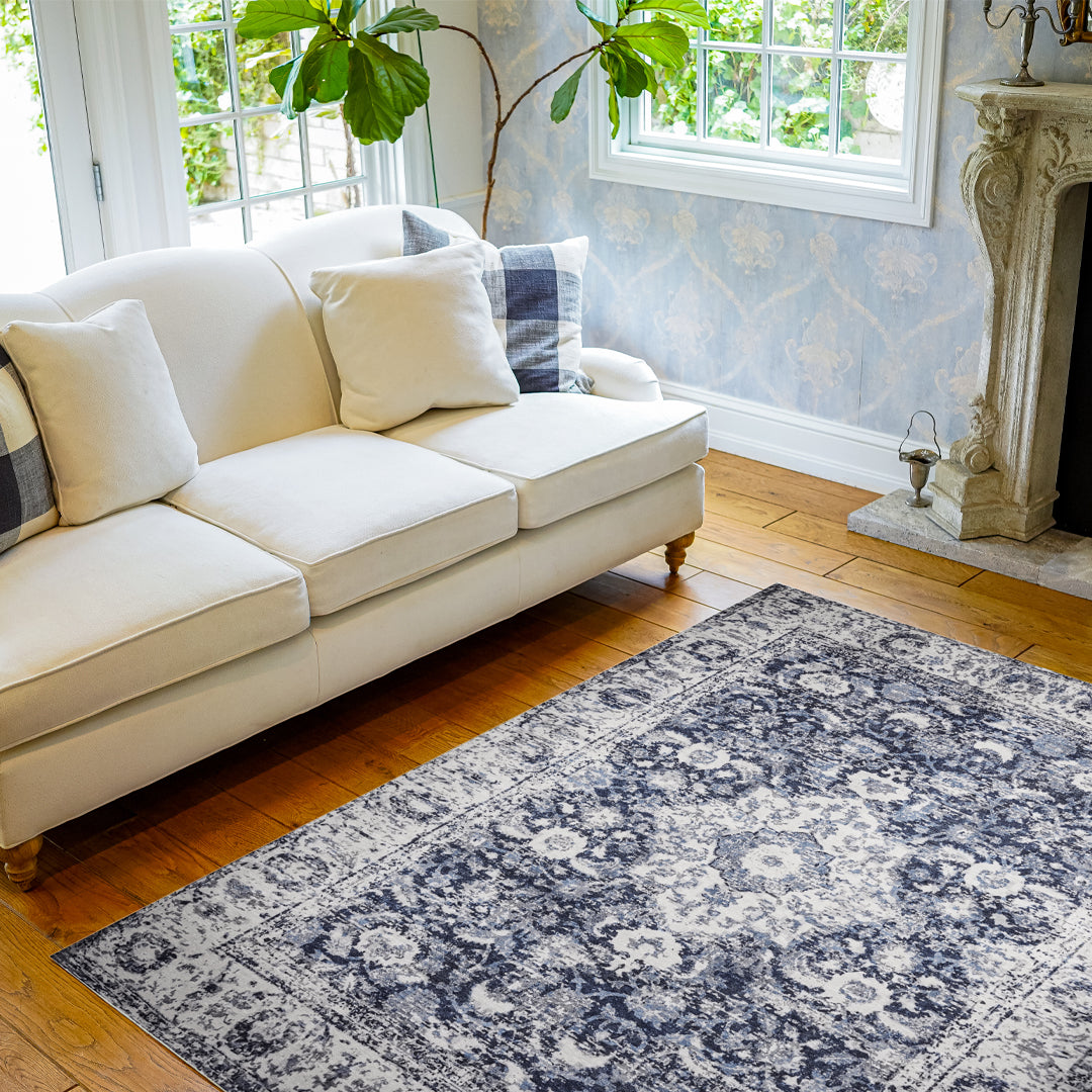 Machine washable area rug in blue and white, recycled material, available in 5x7 and round size, kid-friendly, pet-friendly, eco-friendly design, navy blue, white, distressed blue tones