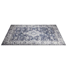 Machine washable area rug in blue and white, recycled material, available in 5x7 and round size, kid-friendly, pet-friendly, eco-friendly design, navy blue, white, distressed blue tones