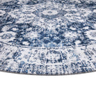 Machine washable area rug in blue and white, recycled material, available in 5x7 and round size, kid-friendly, pet-friendly, eco-friendly design, navy blue, white, distressed blue tones