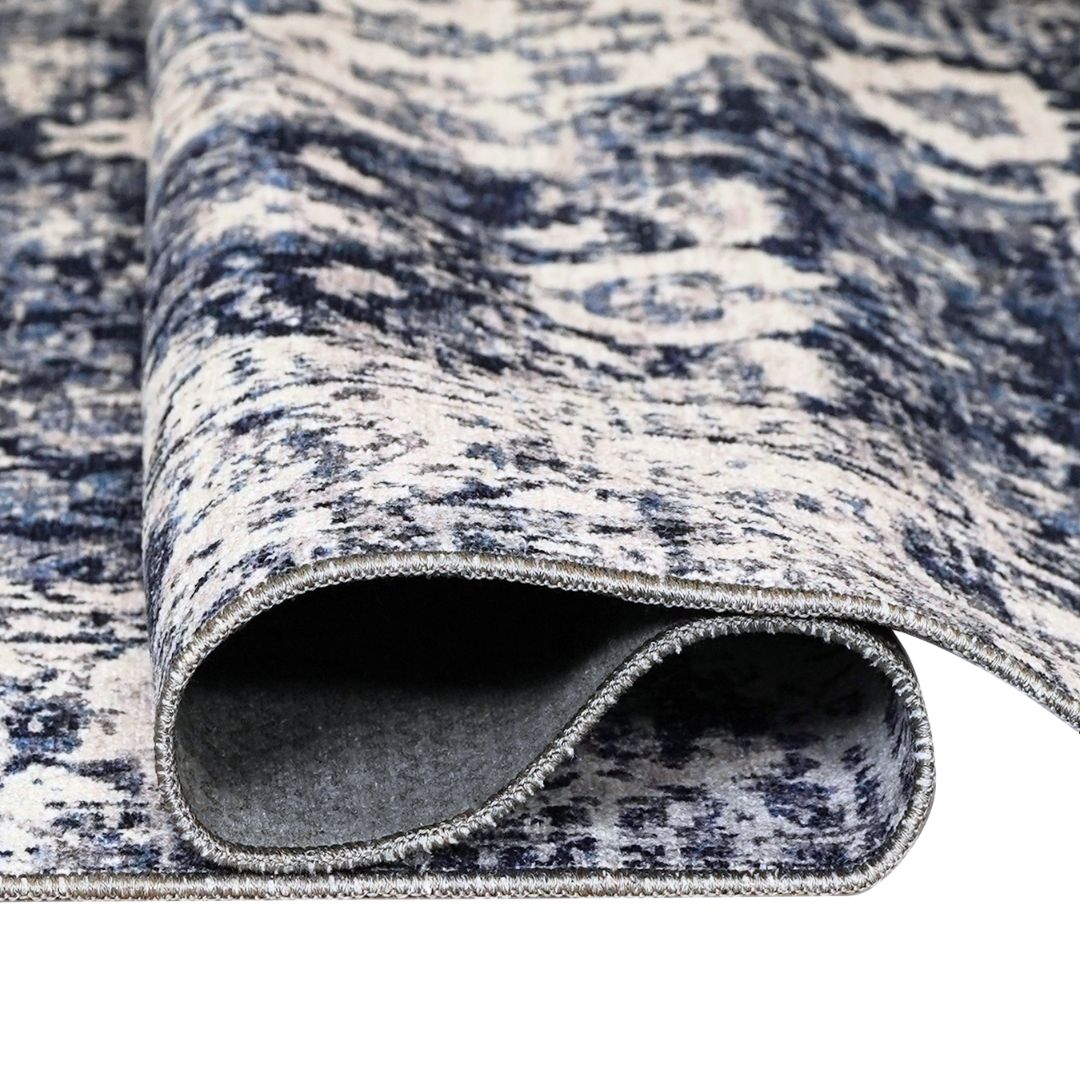 Machine washable area rug in blue and white, recycled material, available in 5x7 and round size, kid-friendly, pet-friendly, eco-friendly design, navy blue, white, distressed blue tones