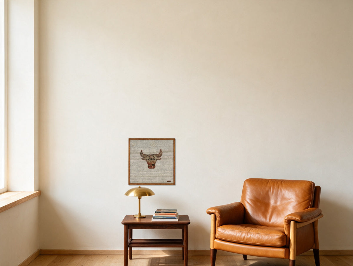 Tan & Rust Kilim Bull on Pale Ivory woven wall art shown hanging in a styled room, for scale - WA-BUL-TAN-5050-010