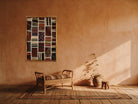 Cream & Black Kilim Patchwork on Warm Rust woven wall art shown hanging in a styled room, for scale - WA-PCH-CRE-6595-064