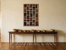 Ivory & Teal Kilim Patchwork on Red & Black woven wall art shown hanging in a styled room, for scale - WA-PCH-IVO-6595-073