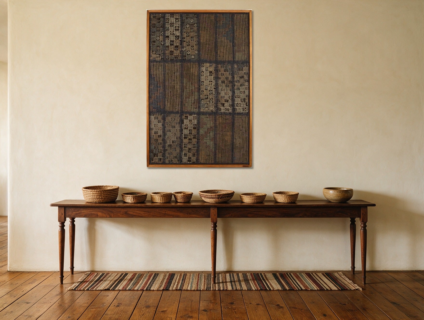 Muted Grey Kilim Patchwork on Indigo & Taupe woven wall art shown hanging in a styled room, for scale - WA-PCH-MUT-70105-081