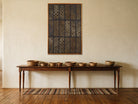 Muted Grey Kilim Patchwork on Indigo & Taupe woven wall art shown hanging in a styled room, for scale - WA-PCH-MUT-70105-081